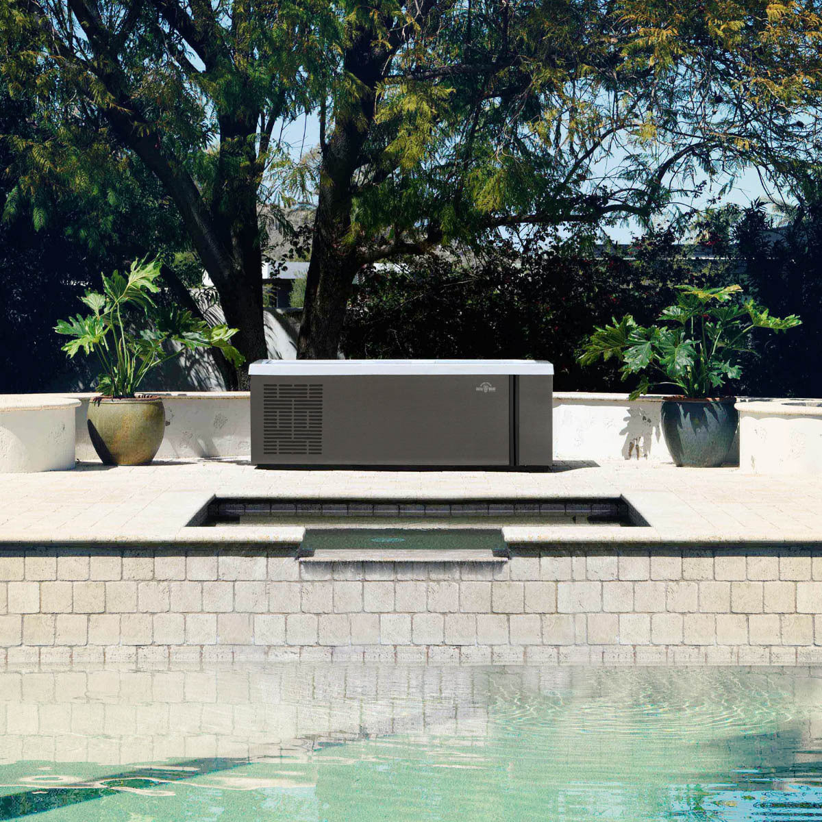 Side view of the cold tub on a pool deck