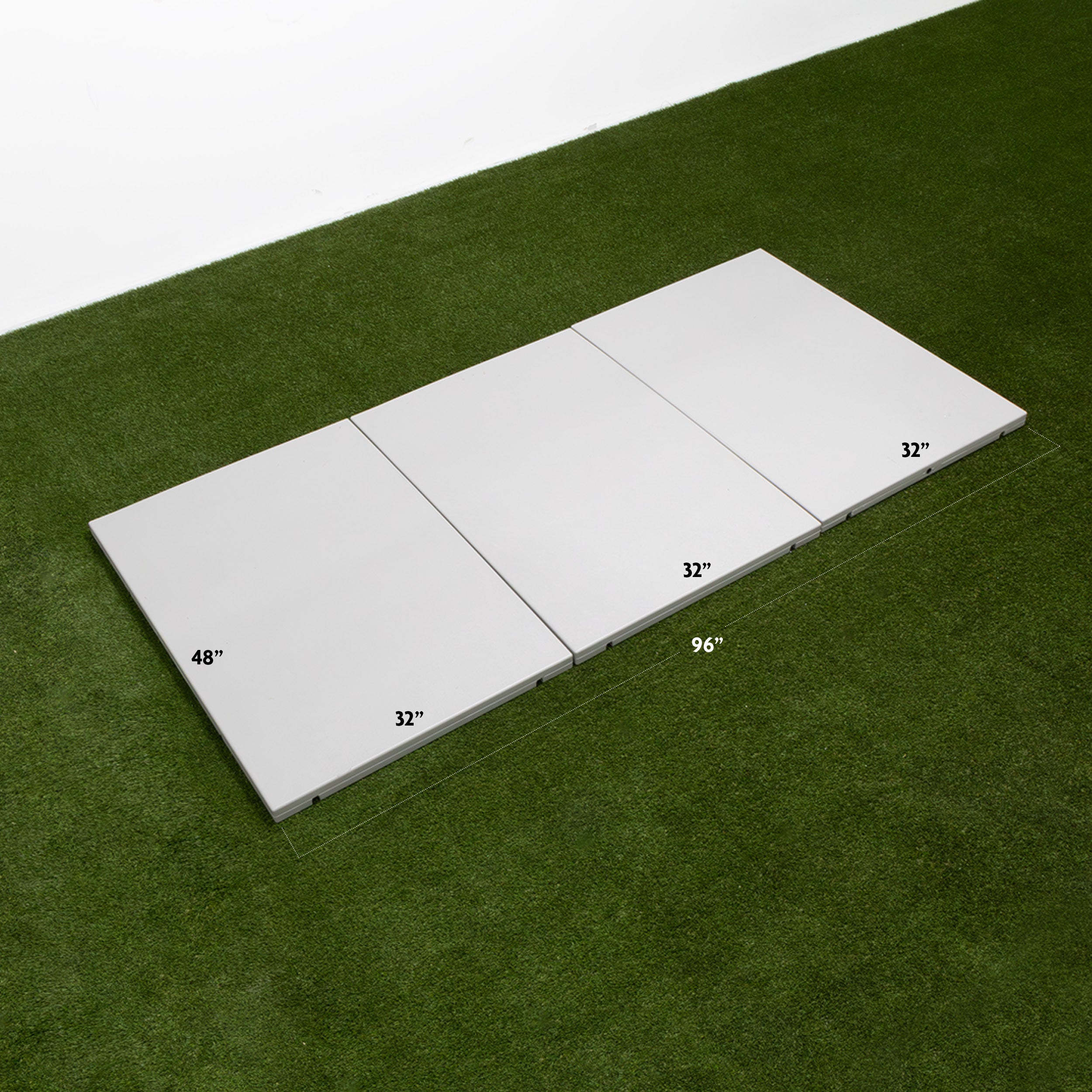 Four rectangular white panels on green turf, measuring 32'x48' and 32'x32' each.